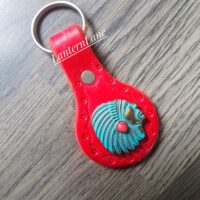 turquoise indian chief concho on red leather key fob