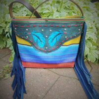 large fringed tote with a colorful serape styled design