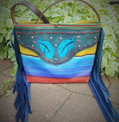 large fringed tote with a colorful serape styled design